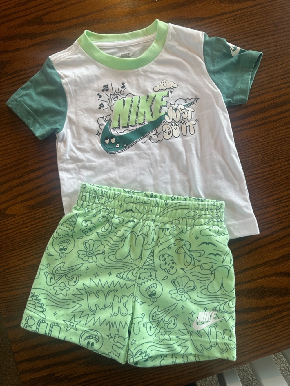 Kids Nike White Tee with Green Accents & Light Green Printed Shorts